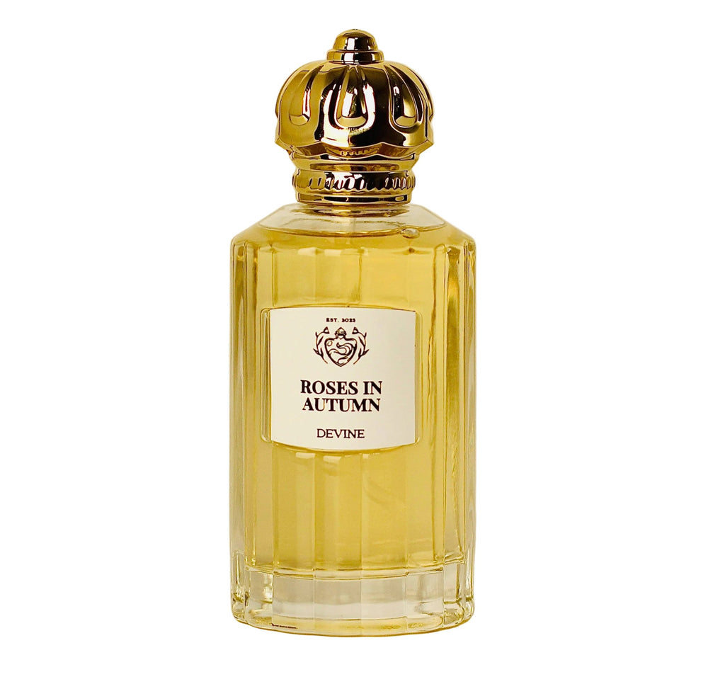 Perfume bottle labeled 'Roses in Autumn' by Devine on a beige background