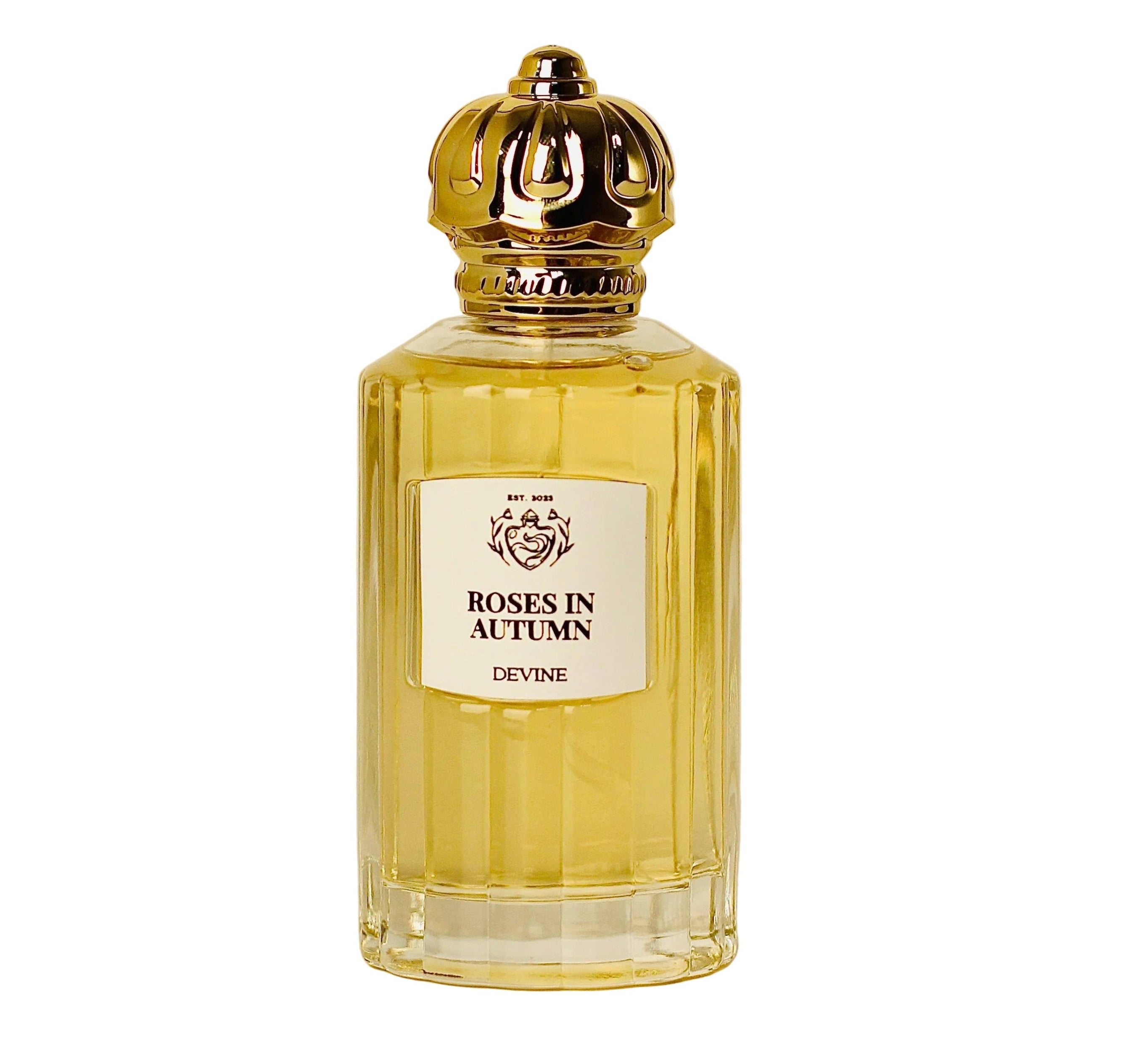 Perfume bottle labeled 'Roses in Autumn' by Devine on a beige background