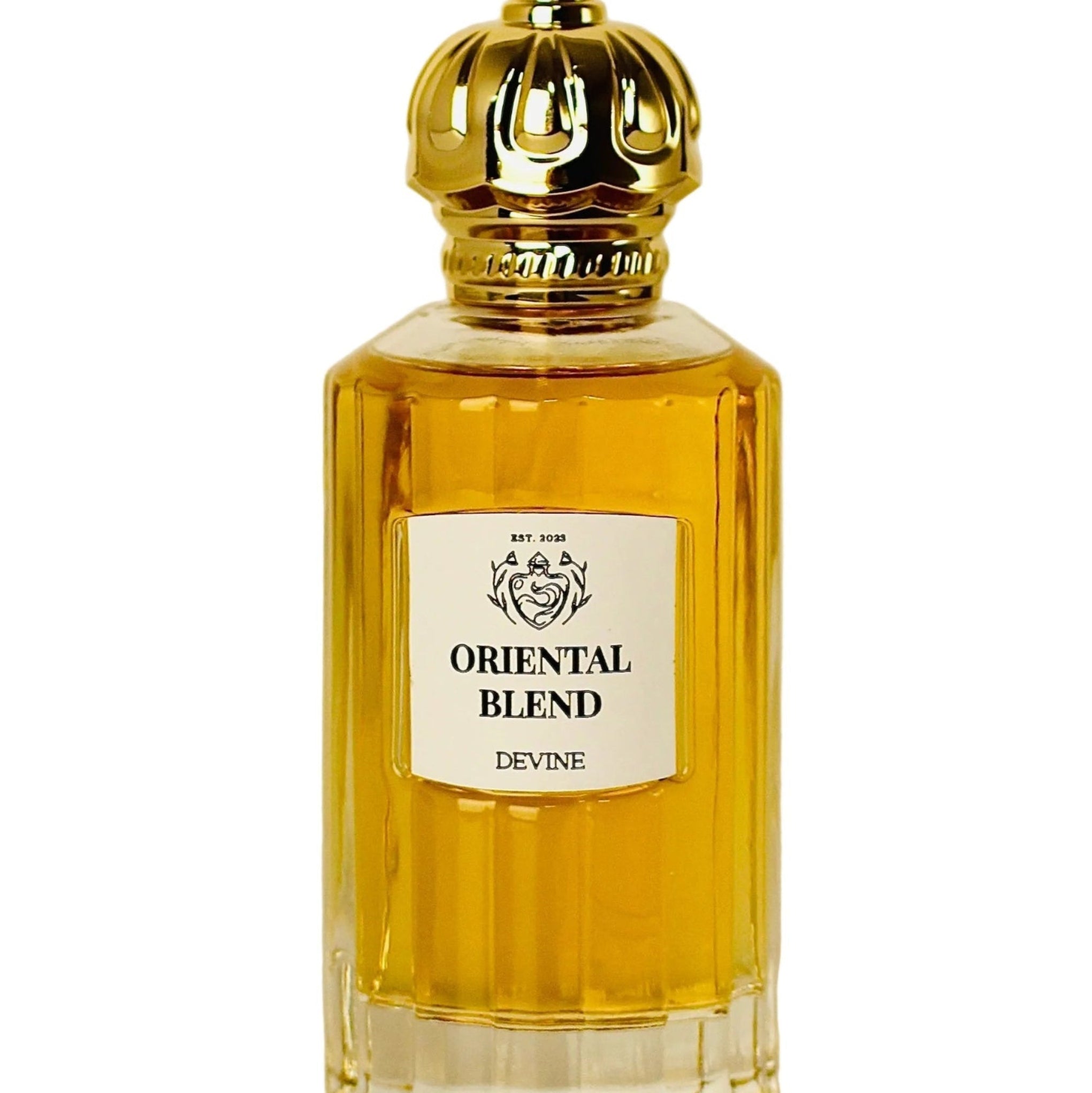 Perfume bottle labeled 'Oriental Blend' by Devine on a beige background