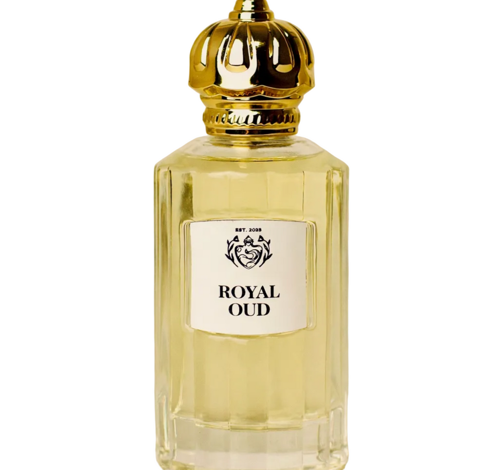 Perfume bottle labeled 'Royal Oud' with a gold cap on a beige background