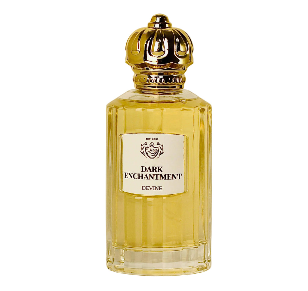 Perfume bottle labeled 'Dark Enchantment' with a gold cap on a white background