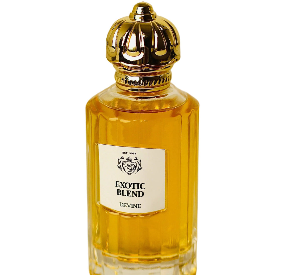 Perfume bottle labeled 'Exotic Blend Devine' with a gold cap on a white background