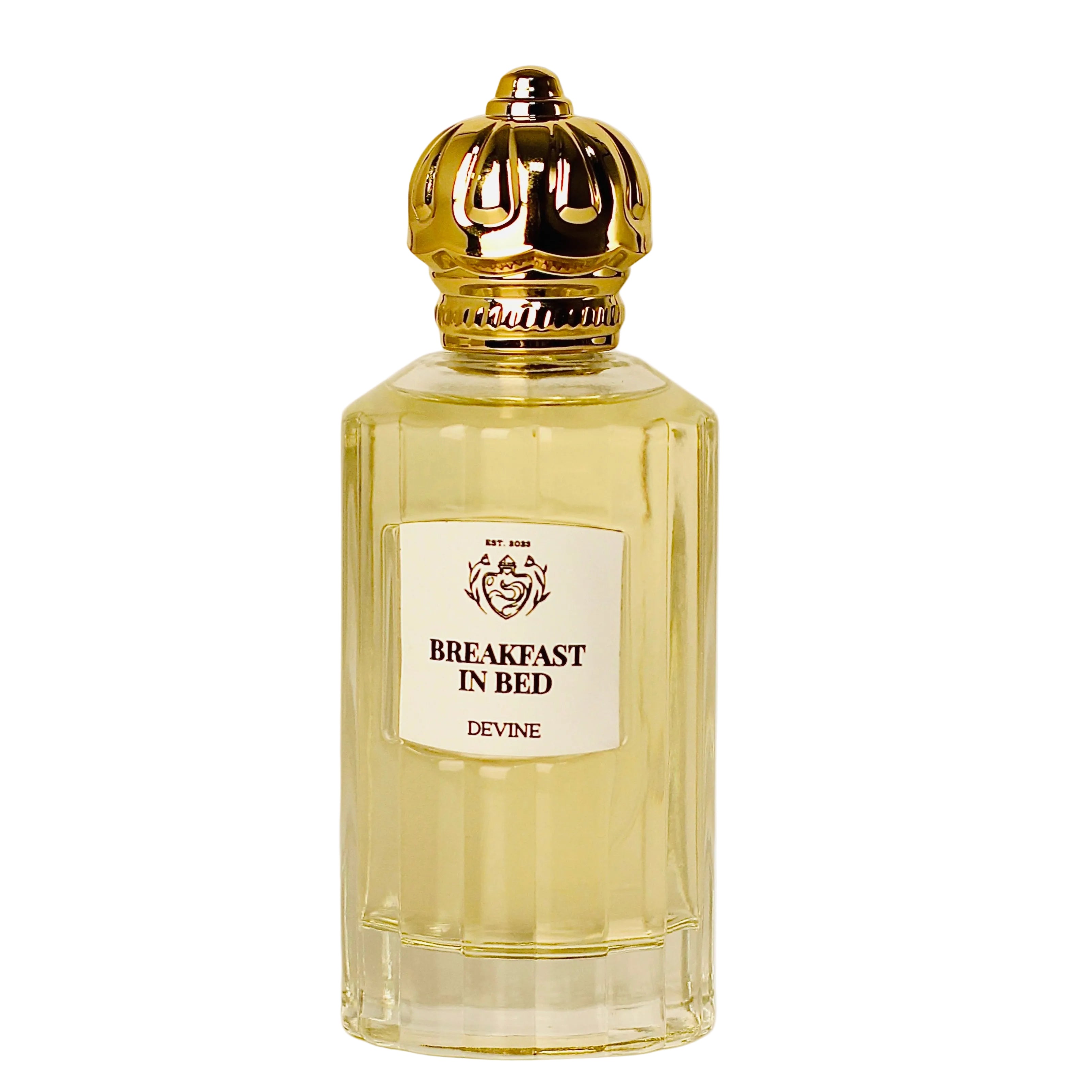 Perfume bottle labeled 'Breakfast in Bed' by Devine on a white background