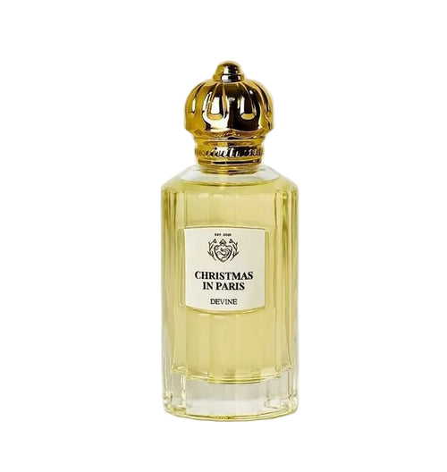 Perfume bottle labeled 'Christmas in Paris' by Devine on a white background